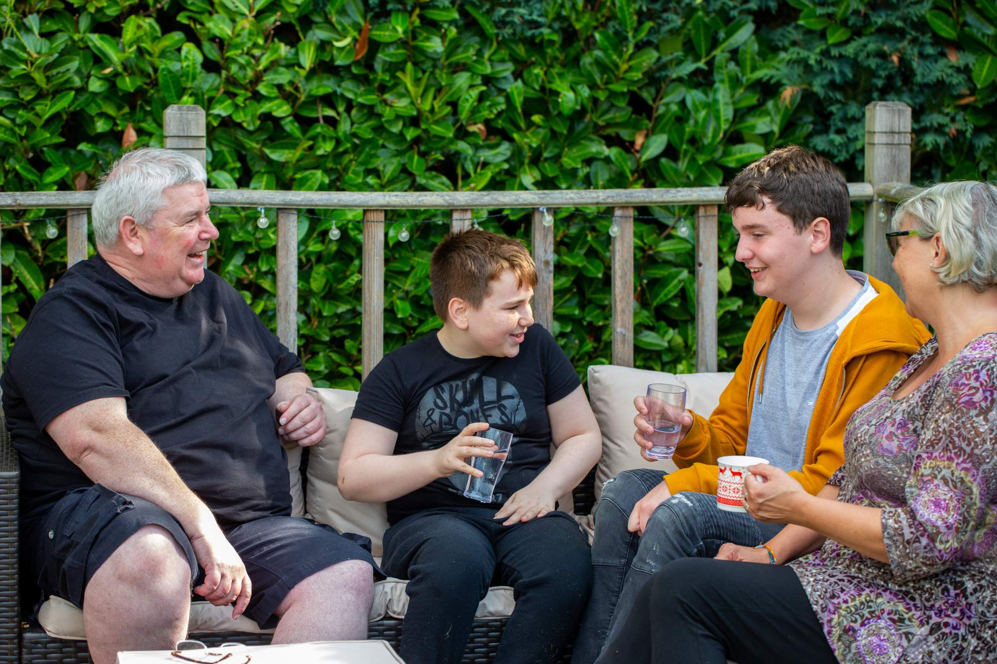 A family sitting together having drinks